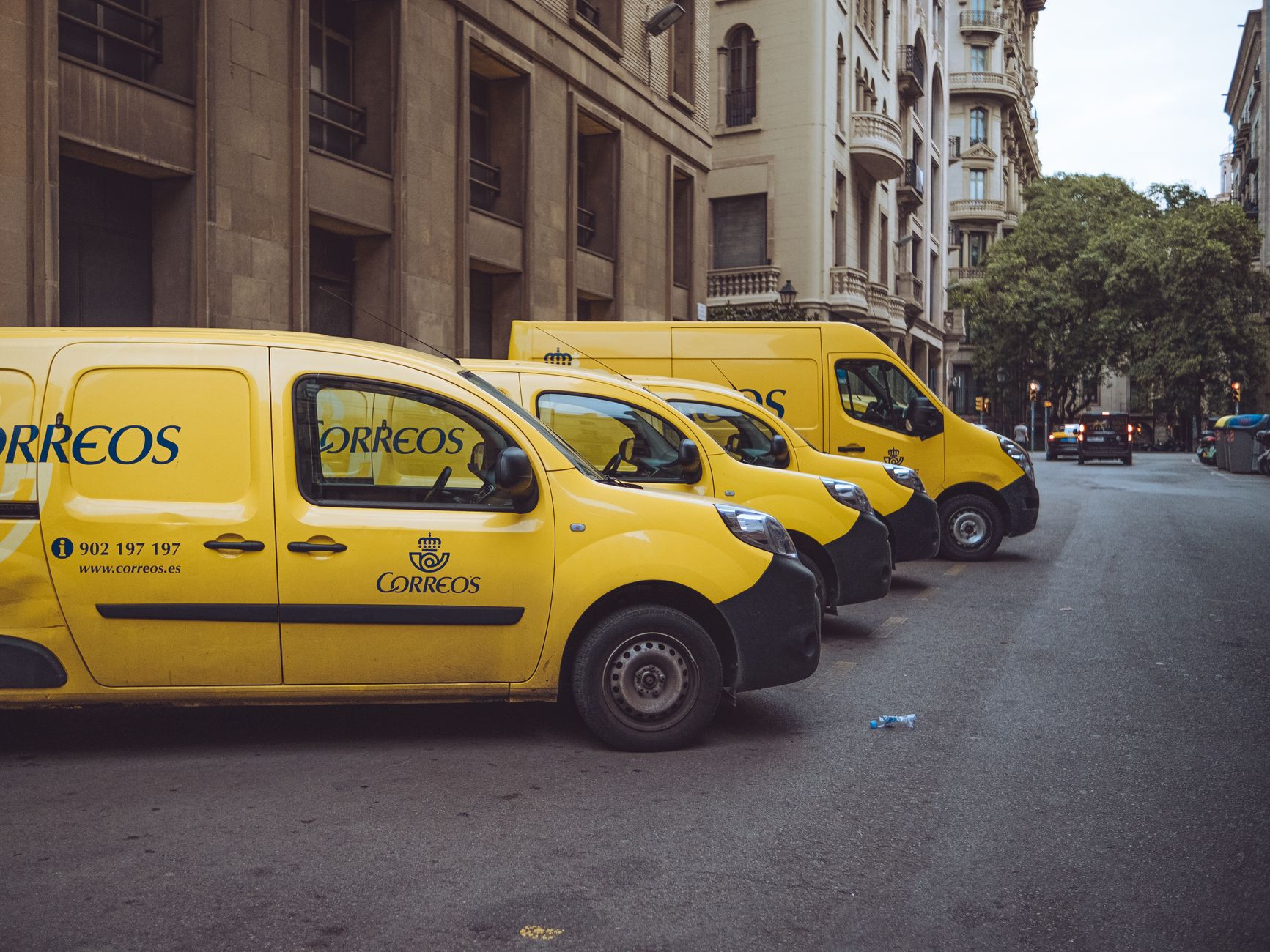 Delivery vans lined up on a city street