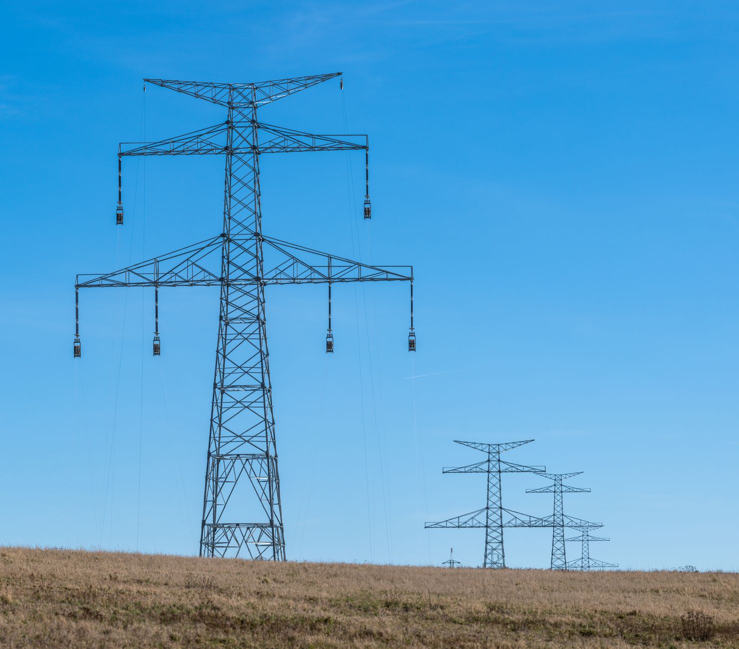 Electricity transmission towers across open country